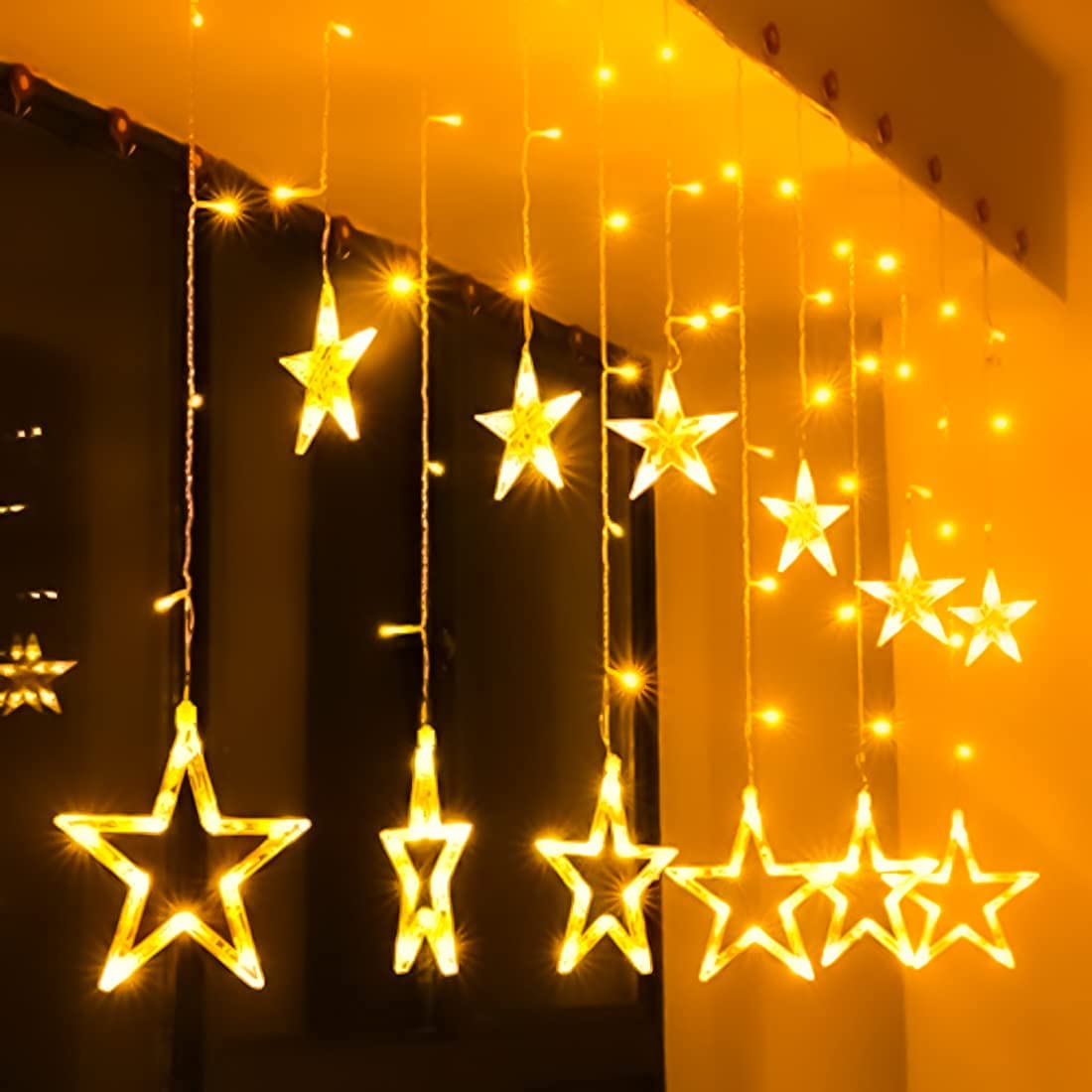 FLYNGO 12 Star Diwali Curtain String LED Lights for Decoration, Window Lights with 8 Flashing Modes, Home Decoration for Diwali, Wedding, Party, Christmas, Balcony – Warm White FLYNGO 12 Star Diwali Curtain String LED Lights for Decoration, Window Lights with 8 Flashing Modes, Home Decoration for Diwali, Wedding, Party, Christmas, Balcony – Warm White